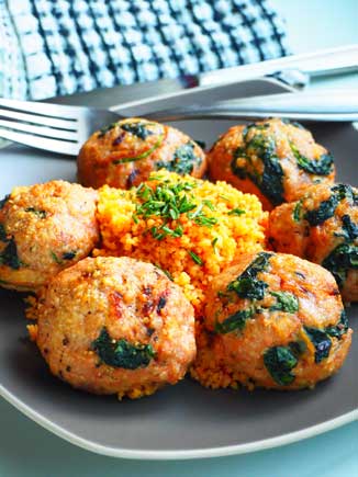 Turmeric Turkey Meatballs served on a plate with couscous