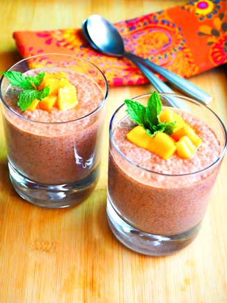 Two glasses filled with healthy vegan mango chocolate chia pudding