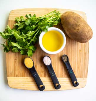 Ingredients-for-Homemade-Pommes-Frites displayed on cutting board