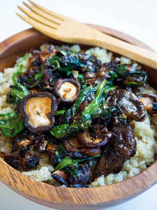 Close up picture of Mushroom Quinoa in a wooden bowl