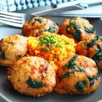Turmeric Turkey Meatballs served on a plate with couscous