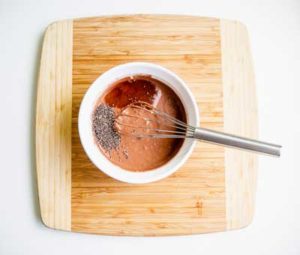All ingredients for Chocolate Chia Pudding in a bowl