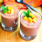 Two glasses filled with healthy vegan mango chocolate chia pudding