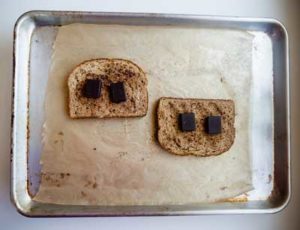 Toasted bread with chocolate squares on top